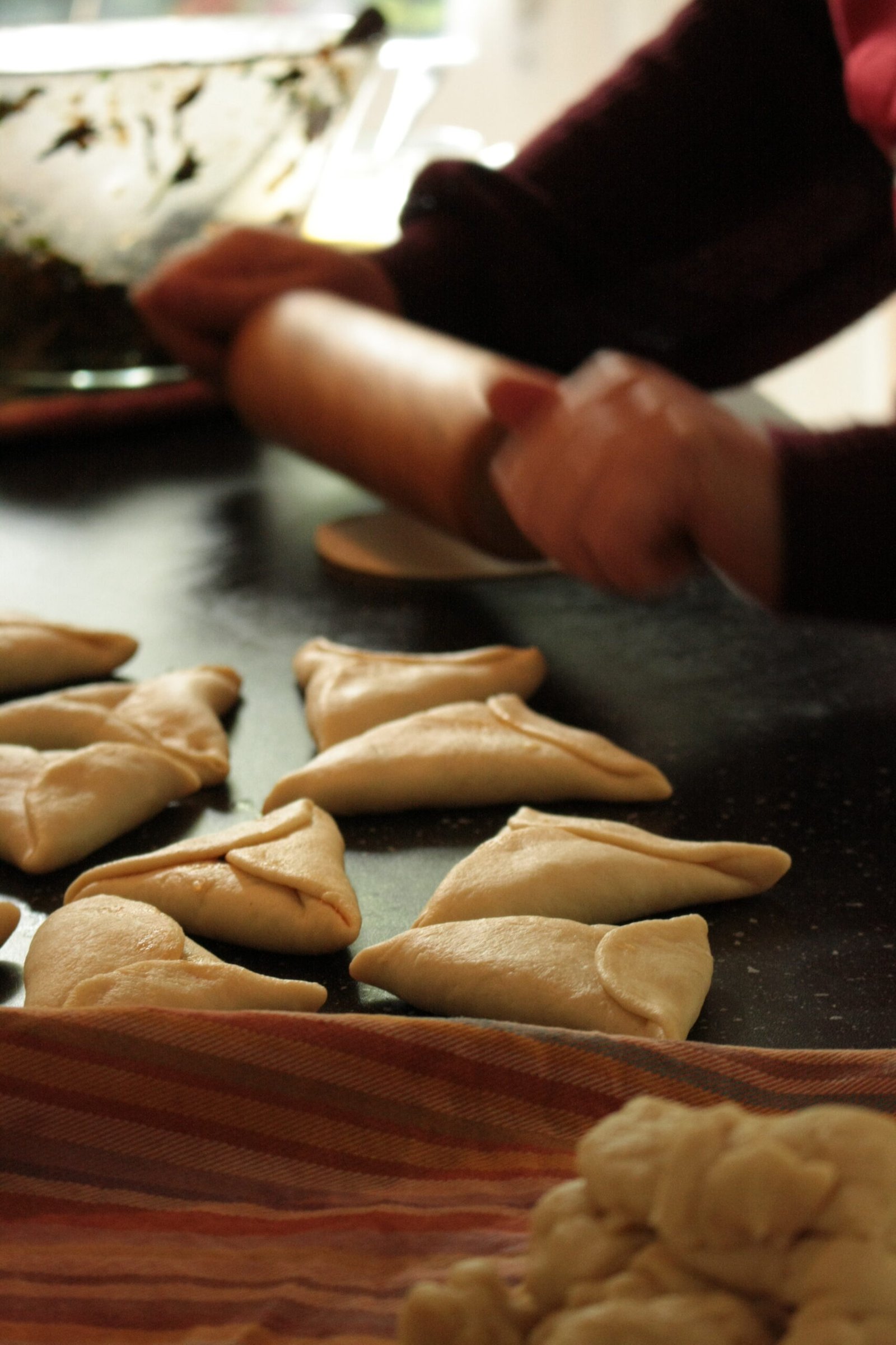 Woman rolling dough.